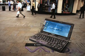 Laptop on the pavement.