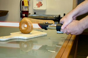 Lightsaber cutting slicing a bagel.