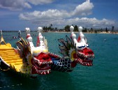 Two dragon boats tied up to the dock.
